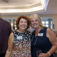 Meg Willit and Sue Jandernoa posing for photo and smiling